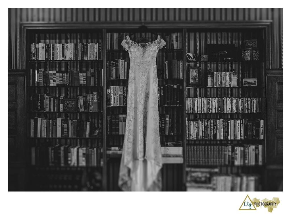 wedding dress on bookshelf