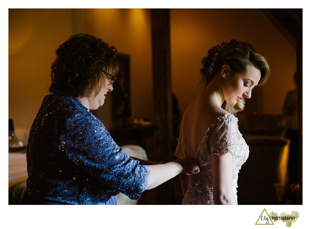 bride getting dress on