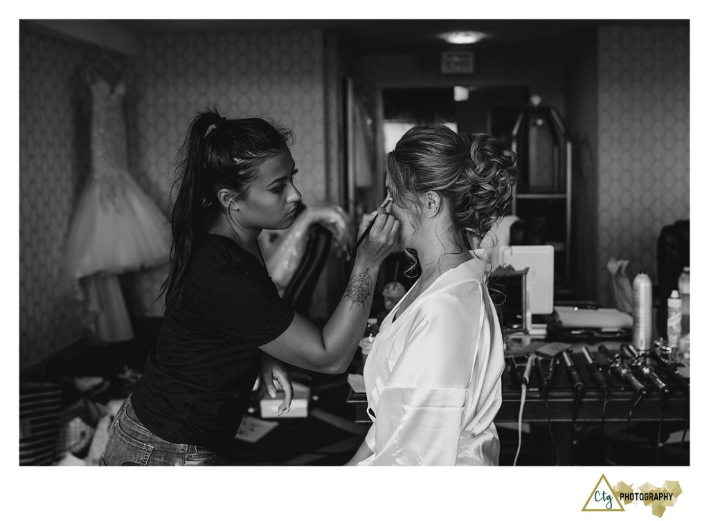 bride getting make up done