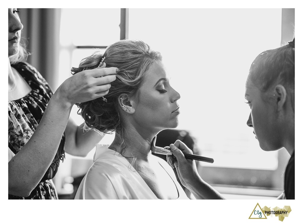 bride getting make up done