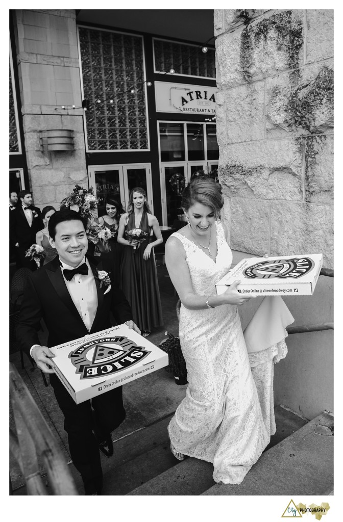 bride and groom with pizza