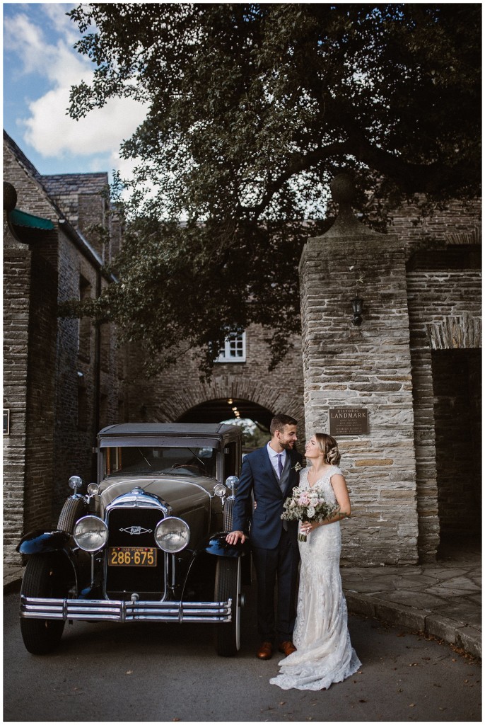 bride and groom with vintage car