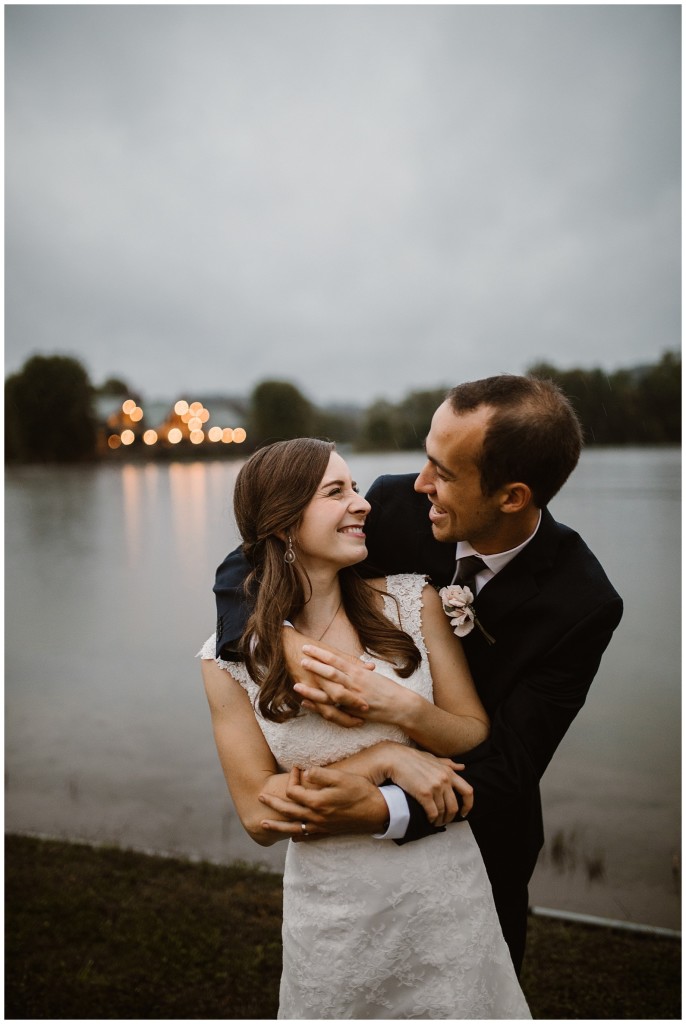 bride in groom in rain