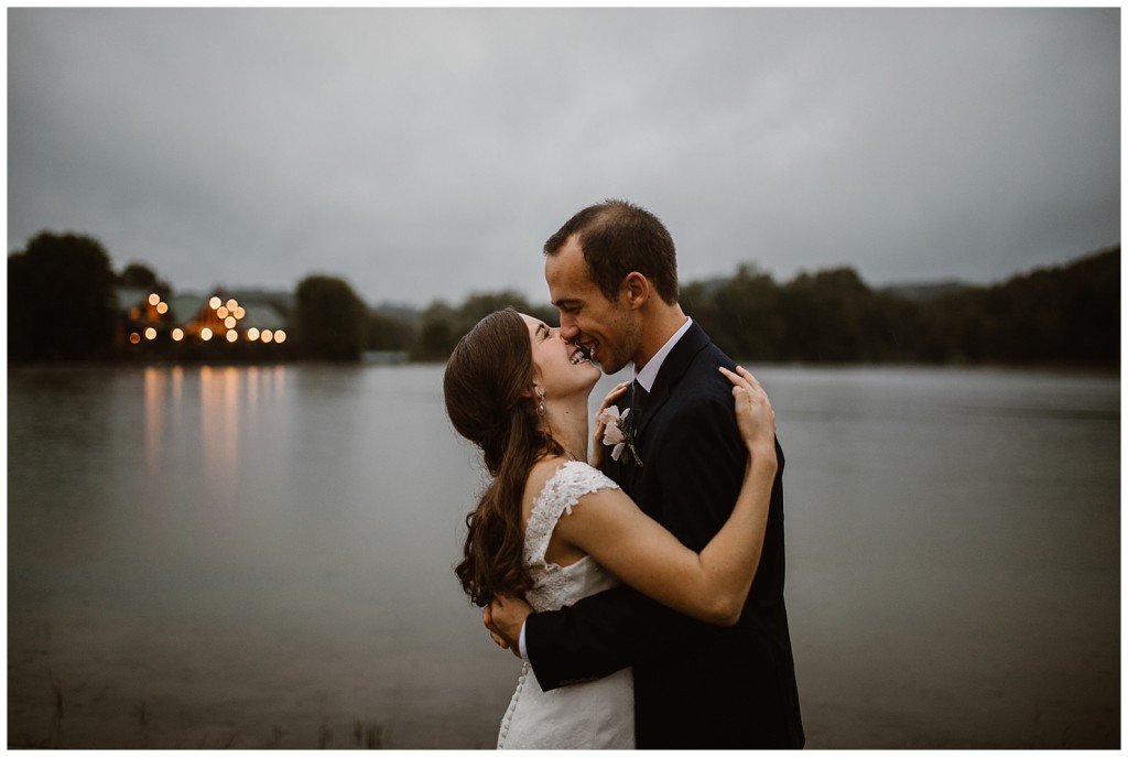 bride in groom in rain