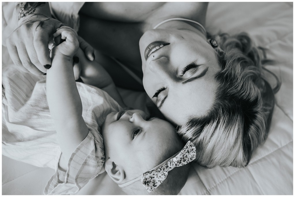 mom with daughter on a bed