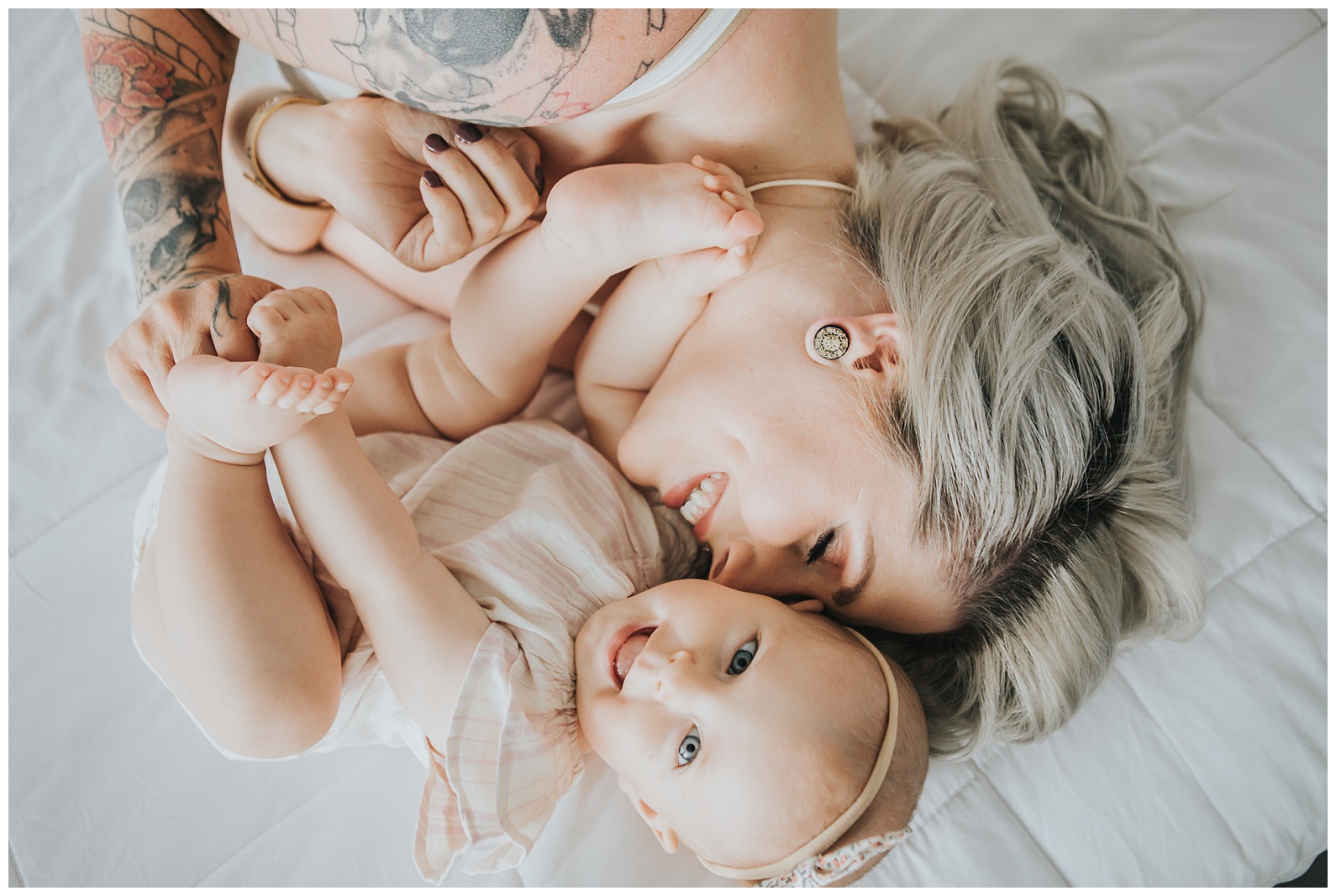 mom with daughter on a bed