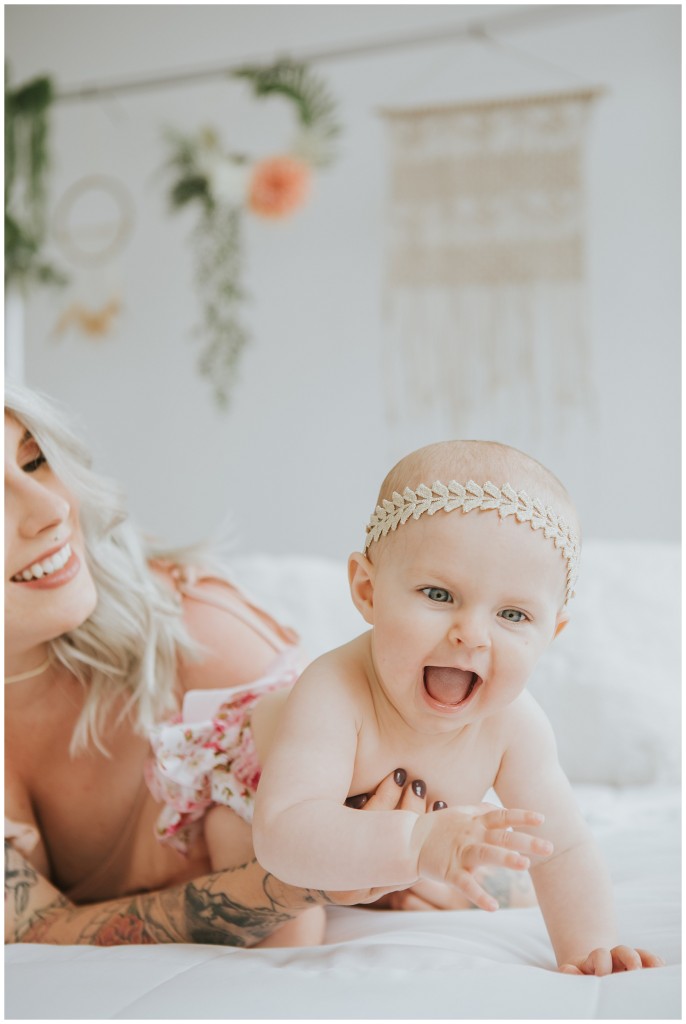 mom with daughter on a bed
