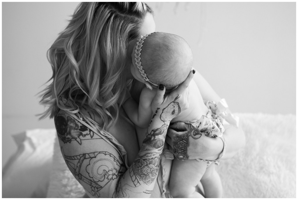 mom kissing daughter