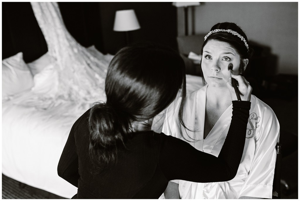bride getting makeup done