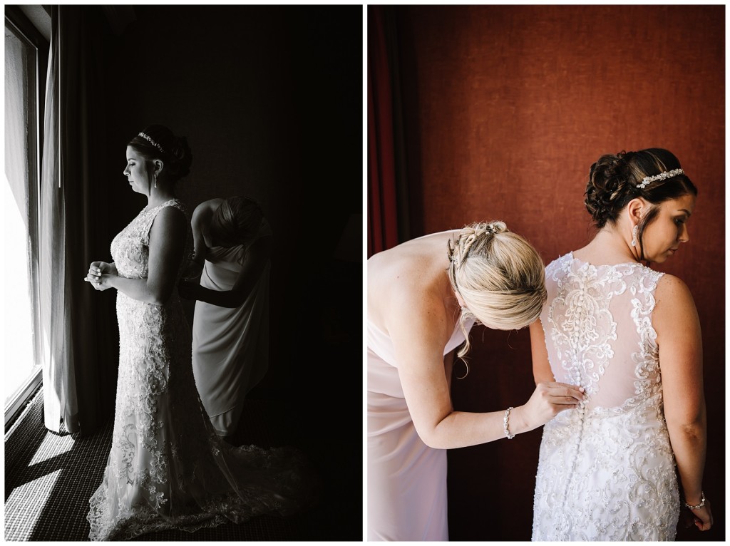 bride getting into a dress