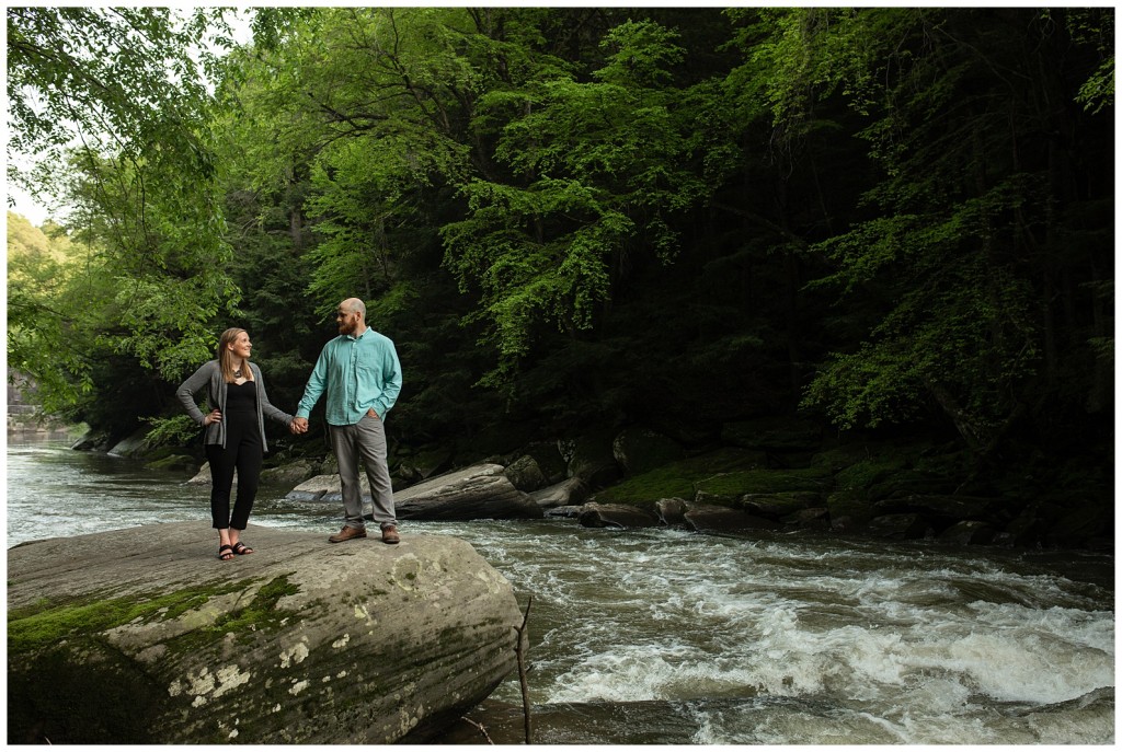 couple standing by river