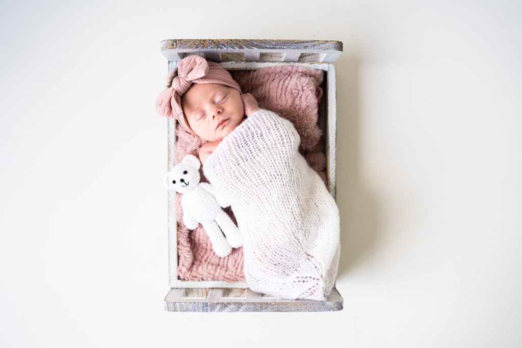 newborn girl and bow