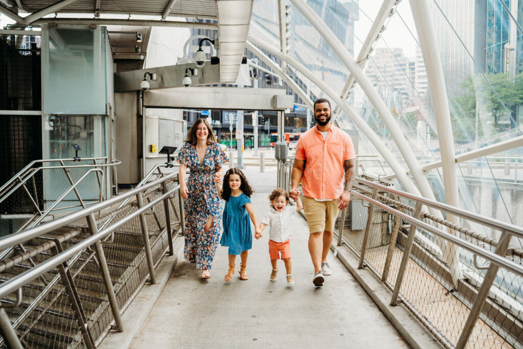 Pgh Family Photographer. Family walking in downtown Pgh