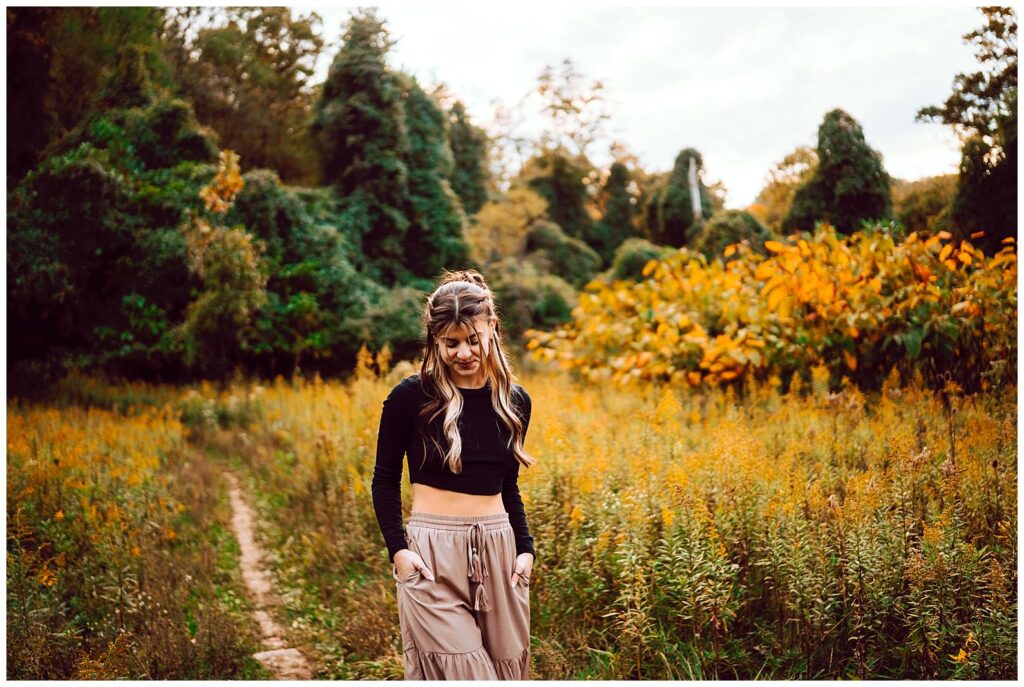 senior walking through a field