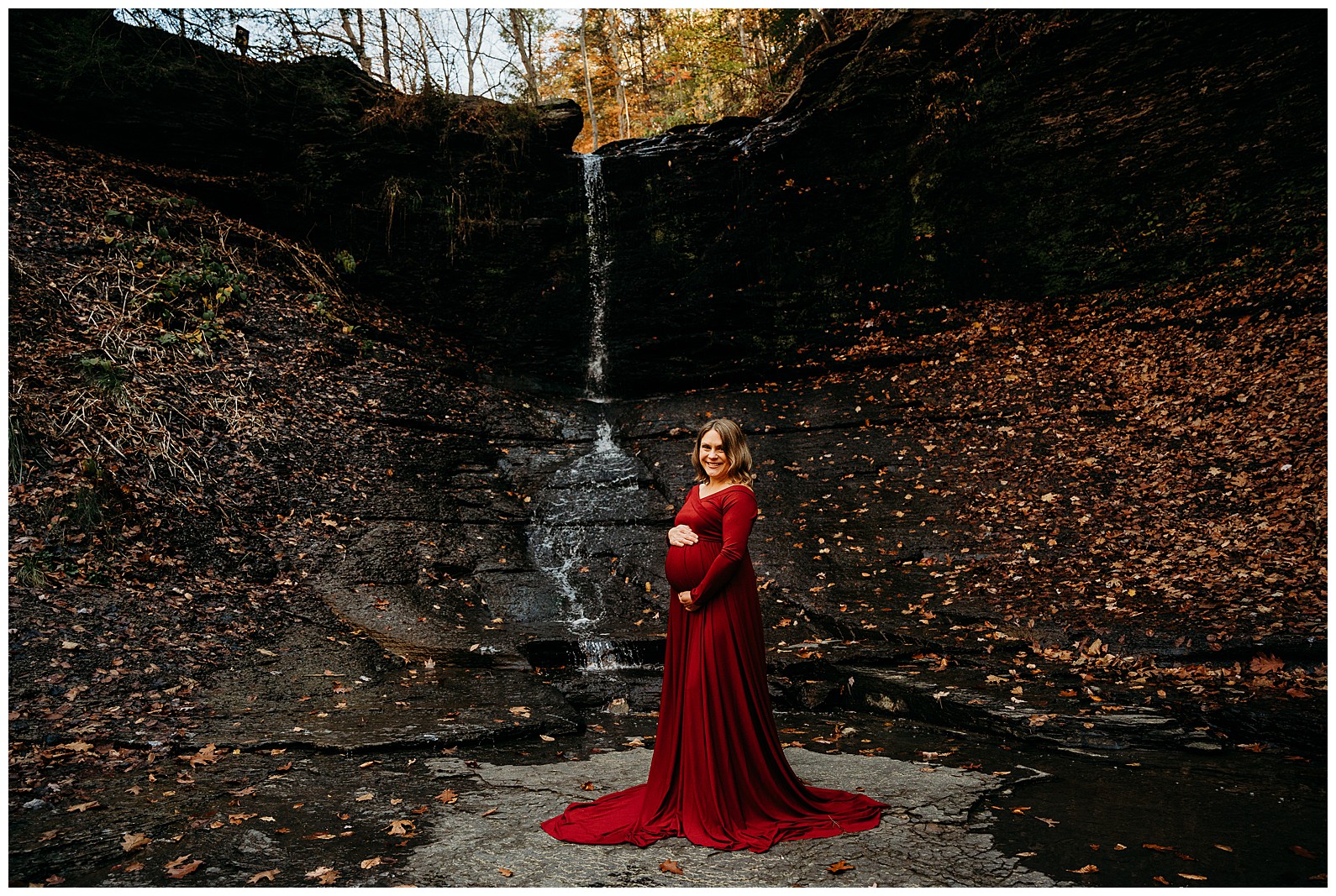 Fall run park maternity photos by waterfall