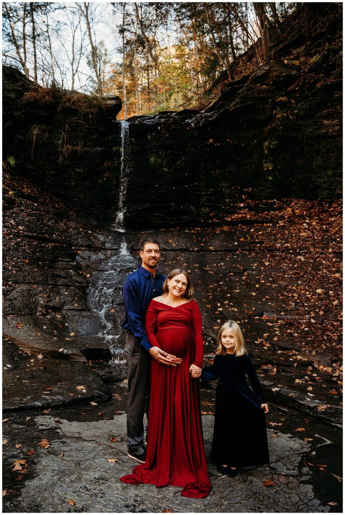 Fall run park maternity photos by waterfall