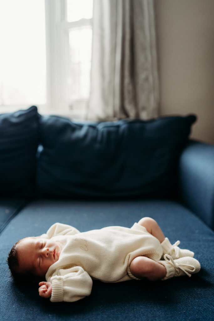 baby laying on couch